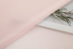 Polka dot embossed satin fabric, 185 g/m² woven polyester, suitable for elegant women's clothing.