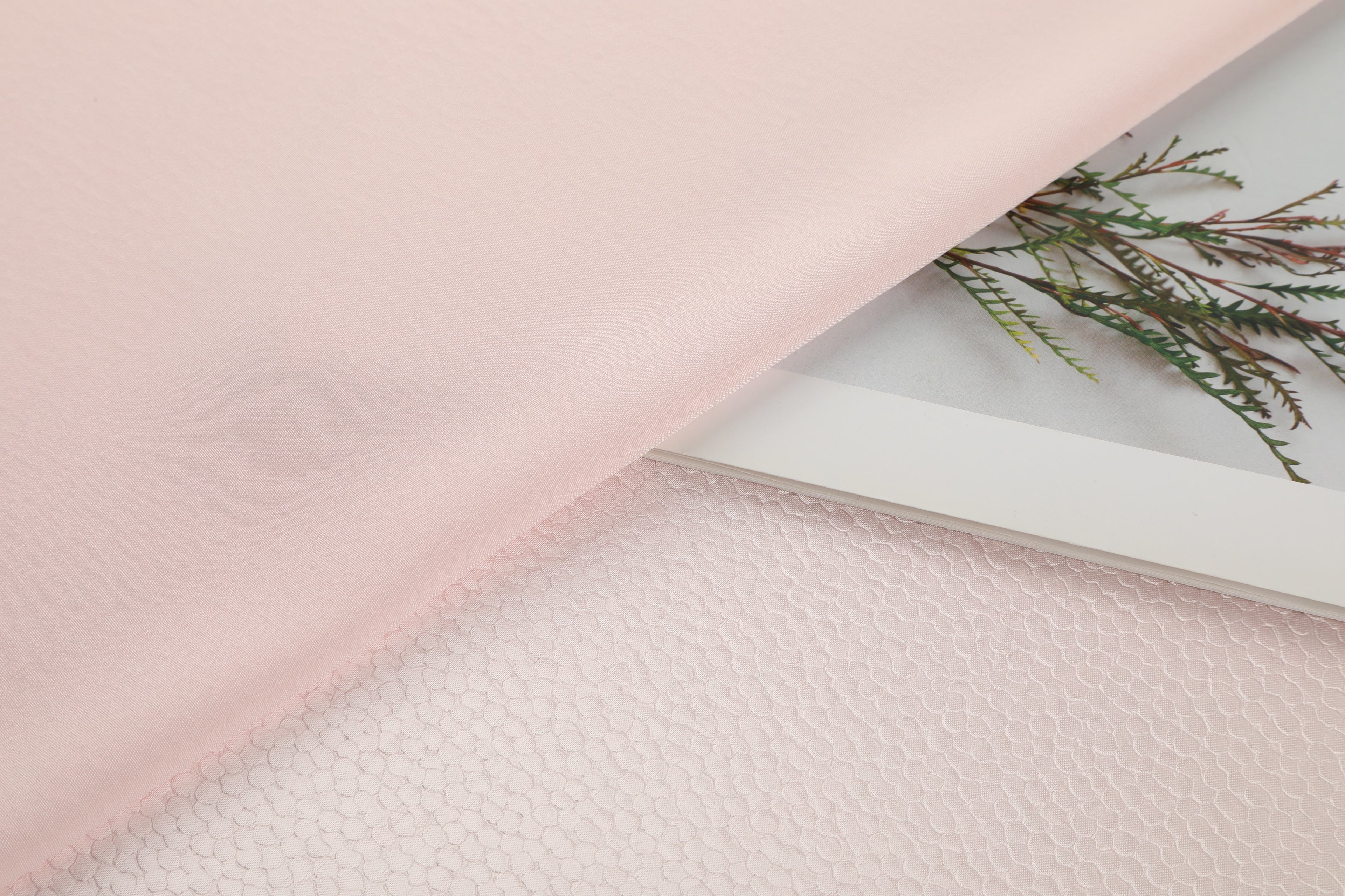 Polka dot embossed satin fabric, 185 g/m² woven polyester, suitable for elegant women's clothing.
